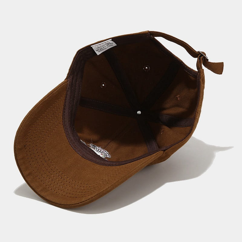 Brown canvas frog mushroom embroidered baseball cap featuring a matching adjustable strap and subtle stitching details.