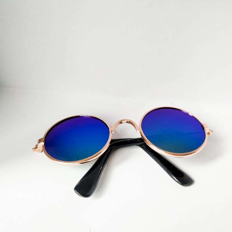 Rose gold metal round cat sunglasses with black temple arms and gradient blue mirrored lenses.