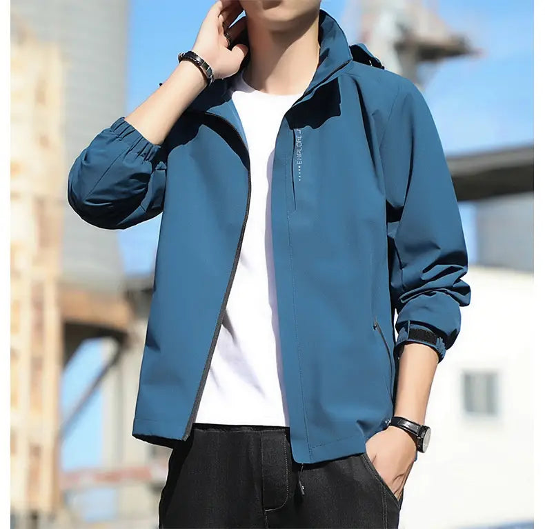 Men’s waterproof sports jacket in blue lightweight material with a hood, featuring a black zipper and trim.