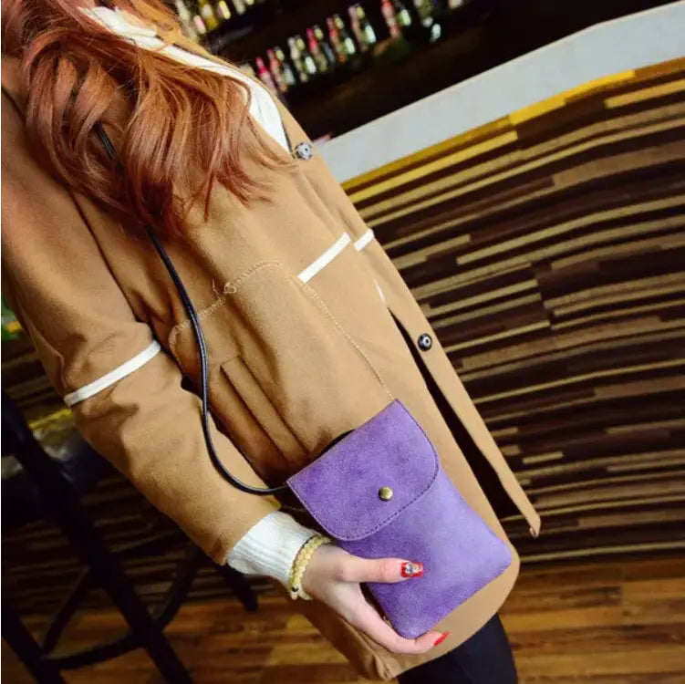 Purple suede clutch with a gold-tone snap closure from the Old Worldly Charm matte suede vegan leather crossbody bag collection.