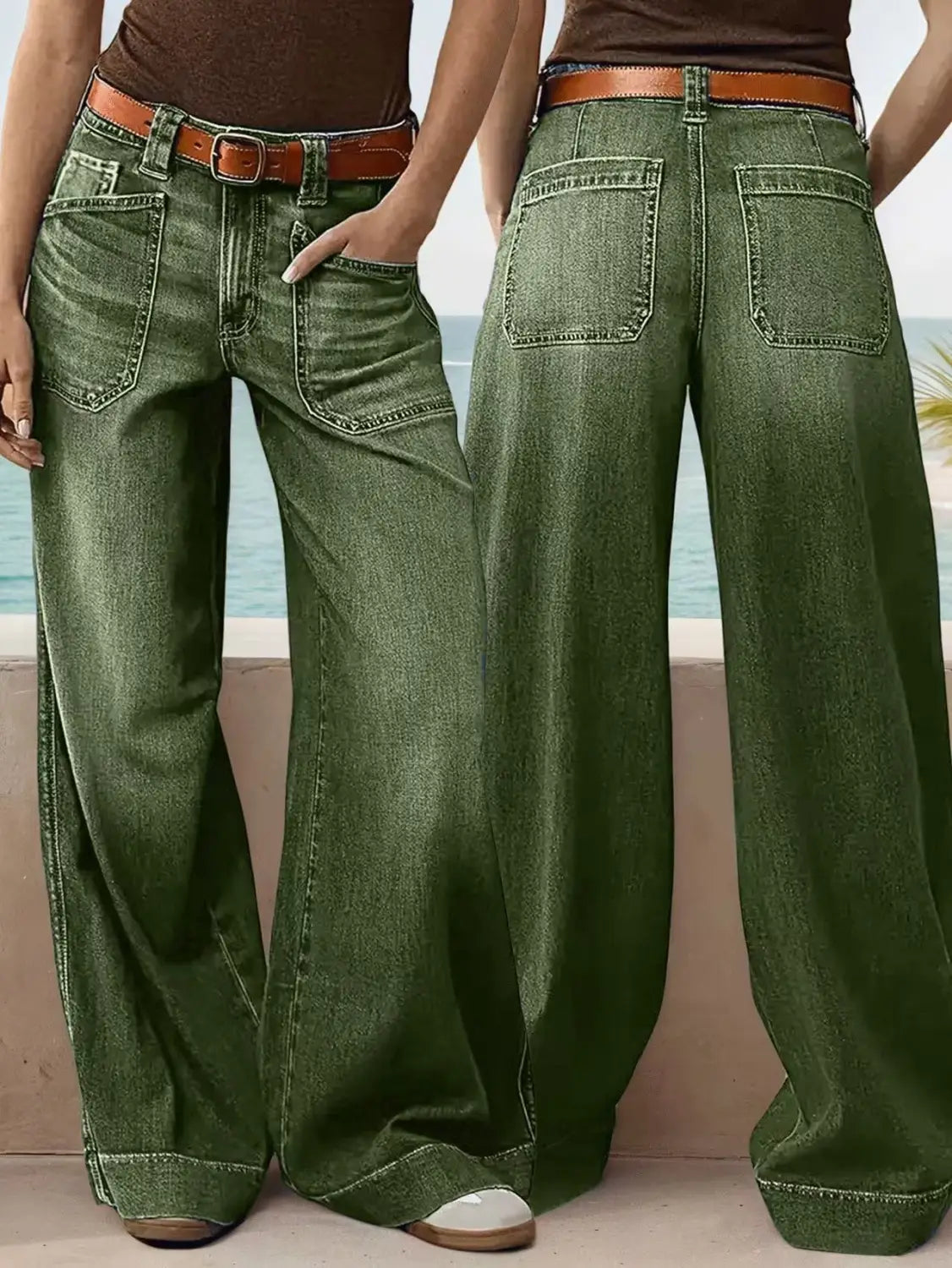 olive green wide leg denim pants made of denim fabric paired with a brown leather belt shown from the front