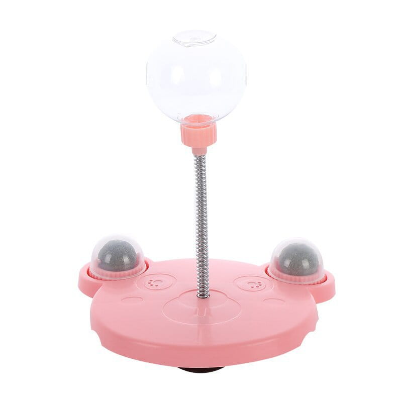 Gobelet distributeur de nourriture pour jouet puzzle en plastique rose en forme de chat, avec dôme transparent et mécanisme à ressort argenté pour l’alimentation de l’animal.