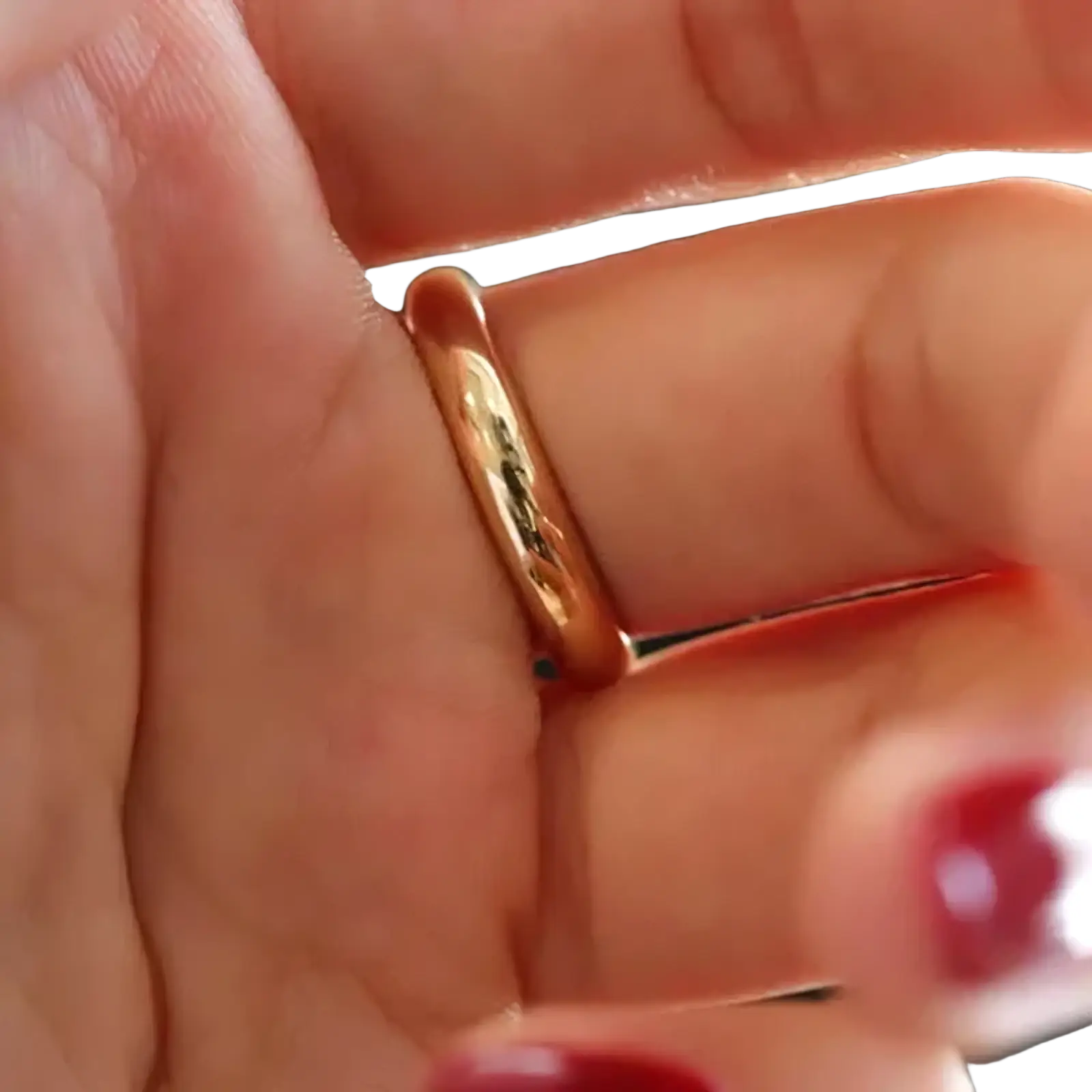 A sleek 18k gold 4mm rose gold wedding band with a smooth polished finish for couples