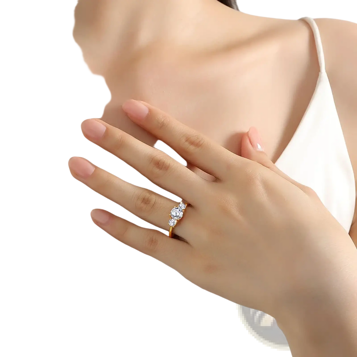 18k gold moissanite three stone ring with a delicate gold band and three sparkling clear stones in a classic design