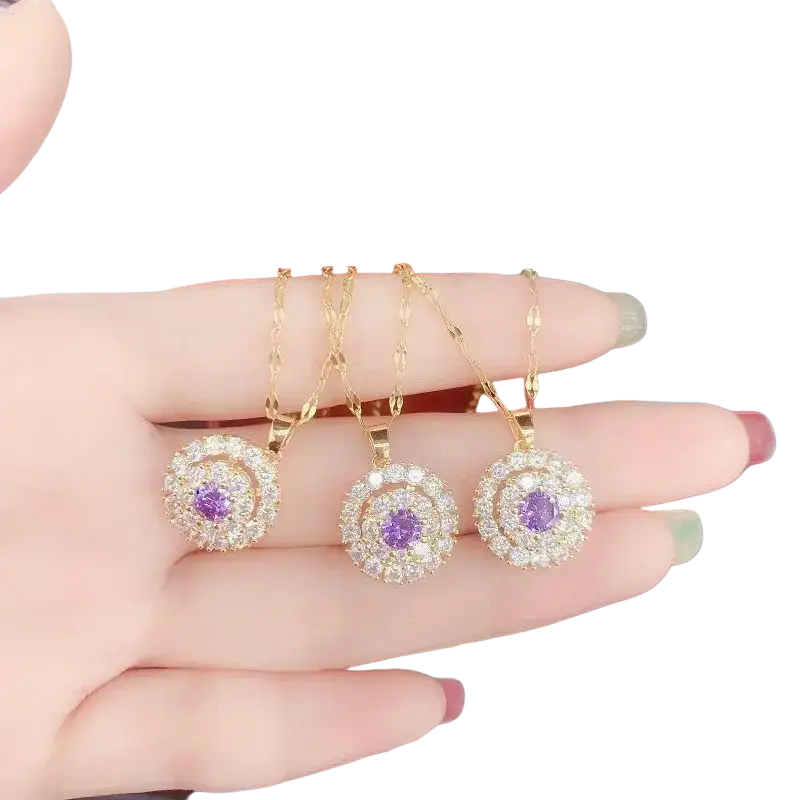 Three gold toned 18k gold necklace pendants with purple gemstones and clear crystals for party engagement wedding