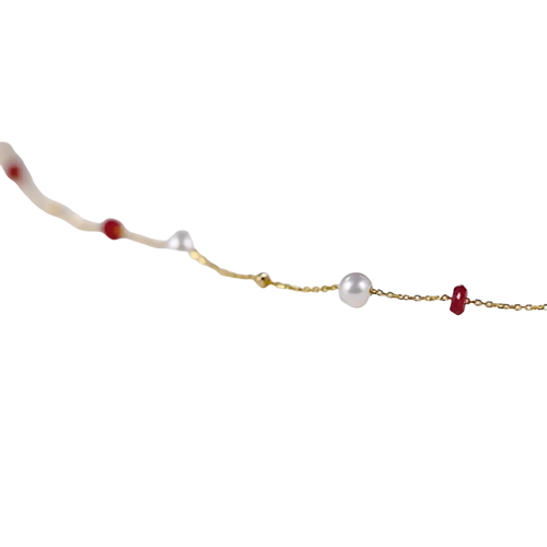18k gold pearl ruby pendant necklace with a delicate gold chain featuring alternating white pearls and red gemstones