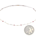 18k gold pearl ruby pendant necklace featuring a delicate gold chain with alternating white pearls and red gemstones
