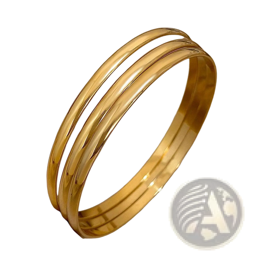 Three sleek polished 18k gold plated minimalist stackable bangles in gold tone for elegant wrist styling
