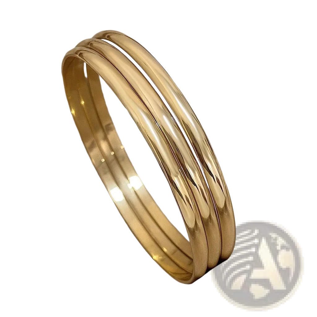 Three sleek gold toned 18k gold plated minimalist stackable bangles with polished metallic finish