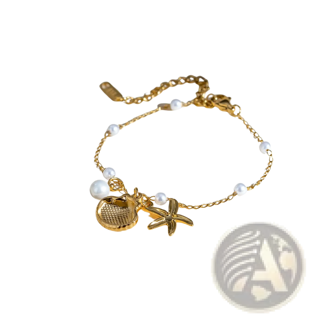 18k gold plated pearl shell and starfish charm bracelet with delicate chain and textured seashell and starfish charms