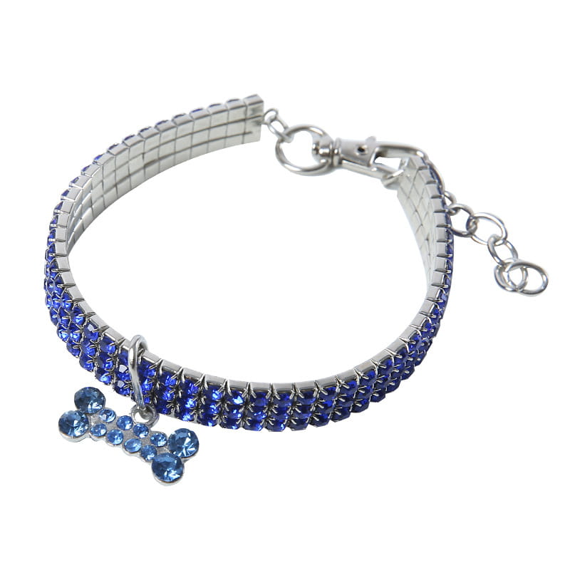 A sparkling blue rhinestone dog collar with a silver-toned metal clasp, adjustable chain, and a matching crystal bone charm.