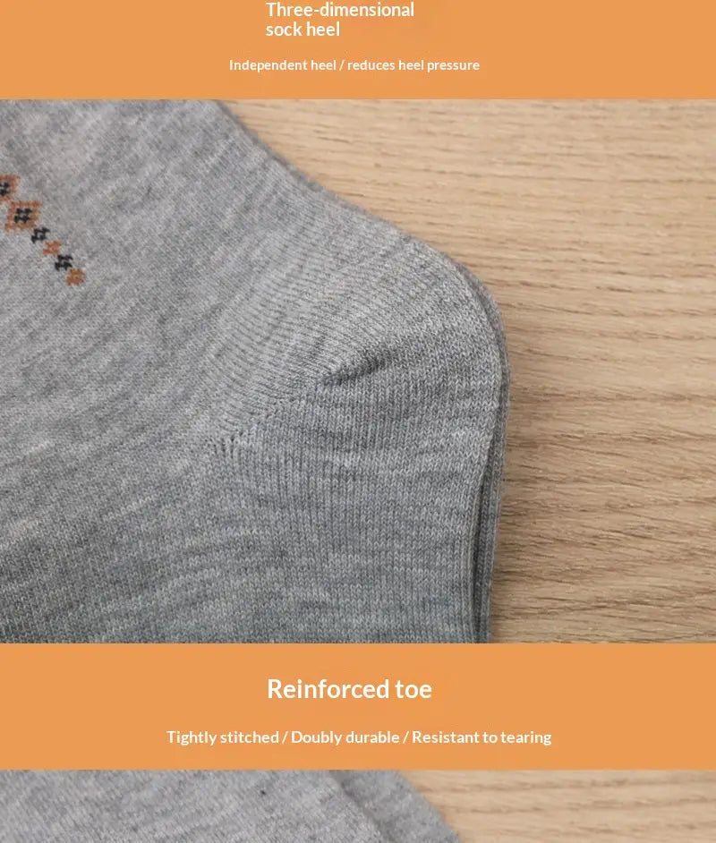 Men mid calf crew socks gray ankle socks with three dimensional heel reinforced toe and subtle brown diamond patterned embroidery near the top.