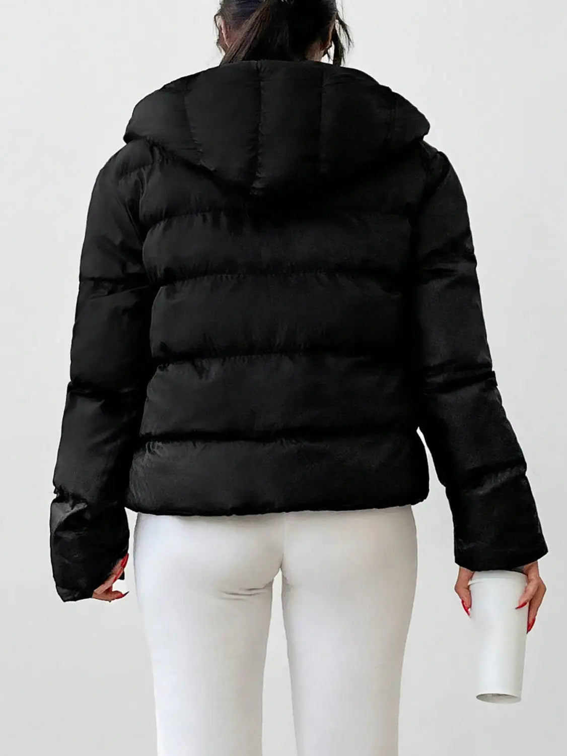 black women’s hooded puffer jacket featuring horizontal stitching and a hood.