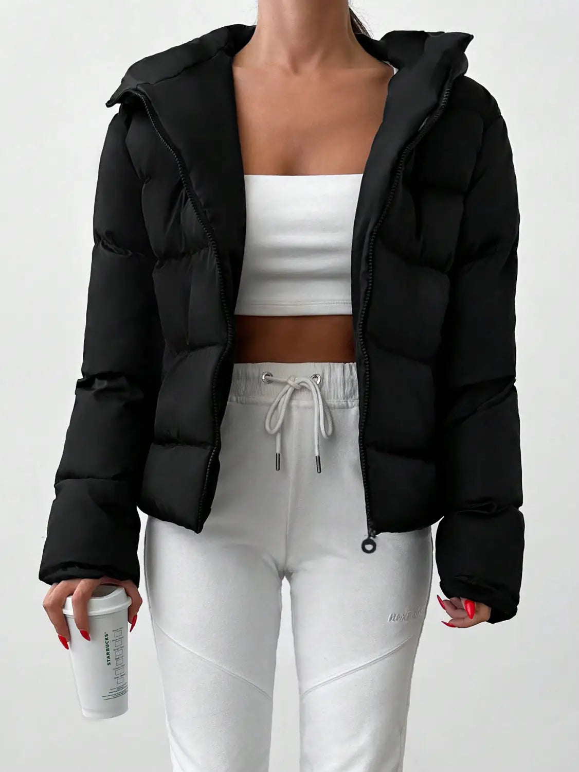 Black women’s hooded puffer jacket with zipper closure designed for warmth and comfort.