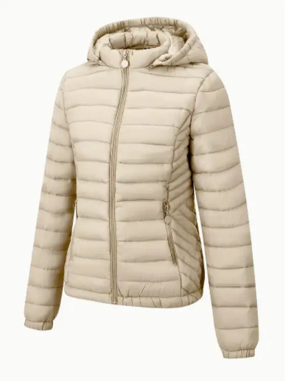 Beige quilted hooded puffer jacket for women with front zipper and side pockets designed for winter wear.