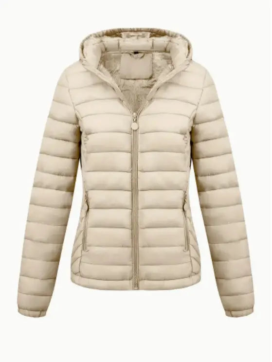 Beige quilted hooded puffer jacket for women with front zipper and side pockets designed for winter wear.