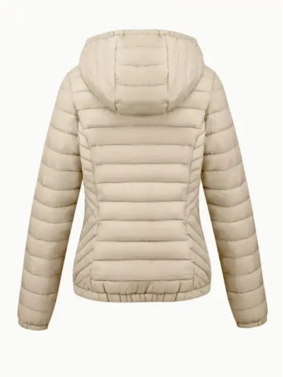 Beige women’s hooded winter jacket featuring quilted puffer design with horizontal stitching and elasticized cuffs.