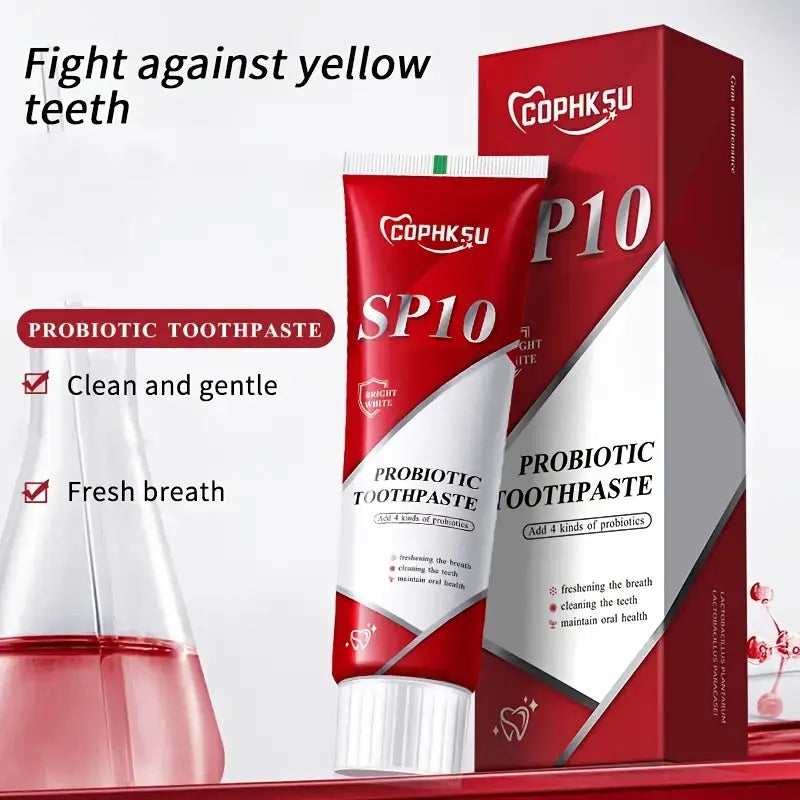 Red and white tube of cophksu sp10 probiotic toothpaste with a silver cap displayed next to its matching red and white box for deep cleaning and fresh breath.