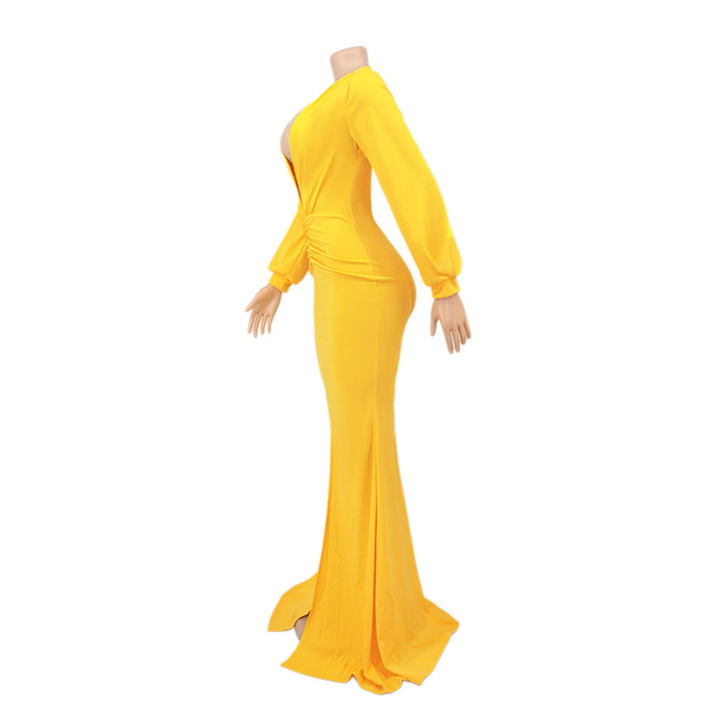 A vibrant yellow velvet v-neck evening dress in a form-fitting mermaid style with long sleeves and a side slit.