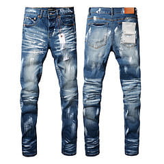 Men’s distressed slim fit patchwork denim jeans in blue with a faded wash and a distressed design.