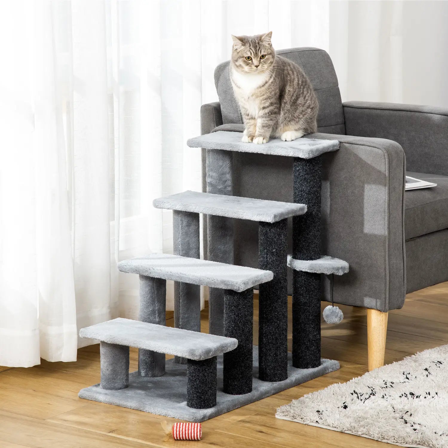 Pawhut gray four step cat tree with textured scratching posts and soft carpeted steps designed for feline activity and comfort.