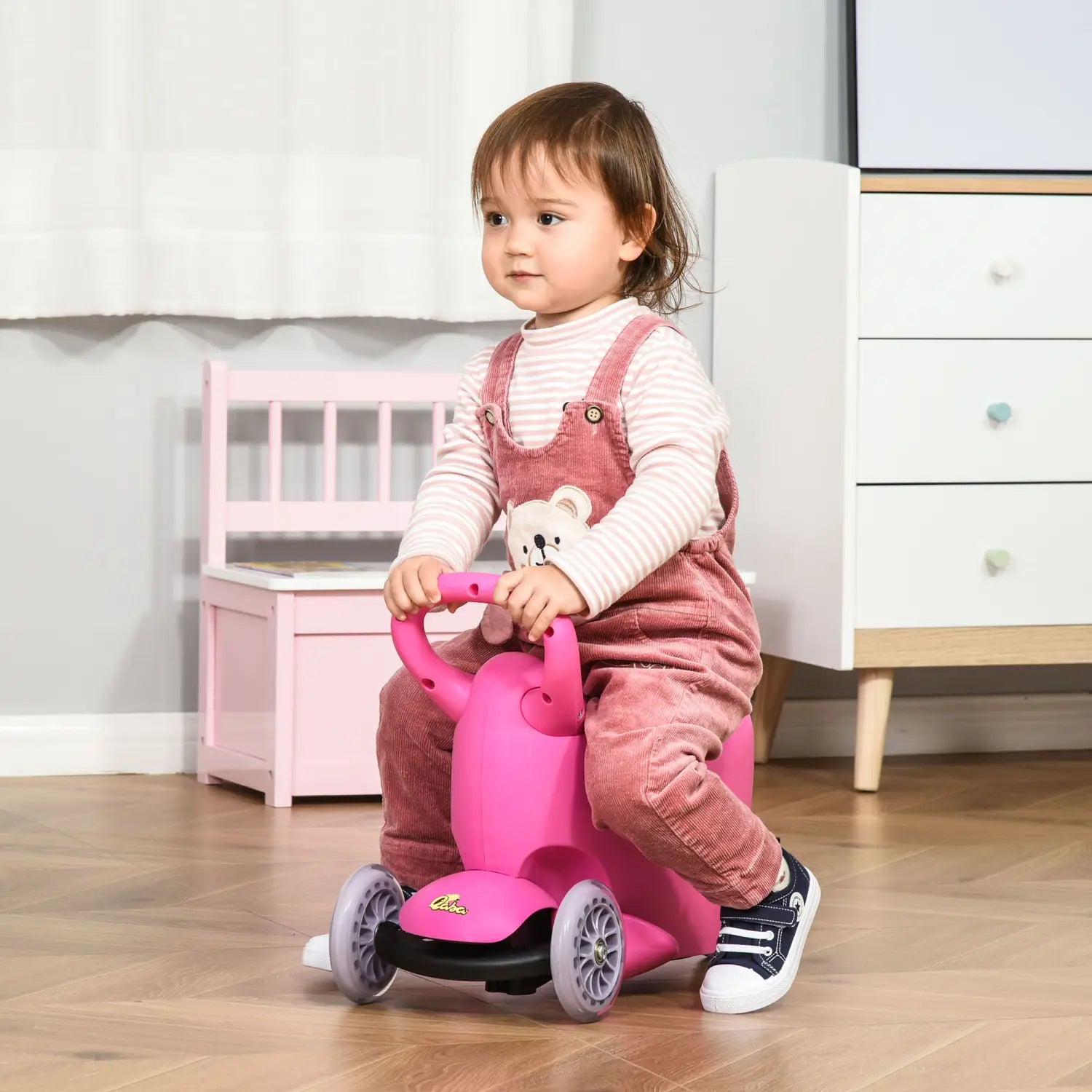 Pink plastic 3-in-1 kids scooter ride on push walker with a bear face and four wheels for toddlers aged 2 to 6 years.