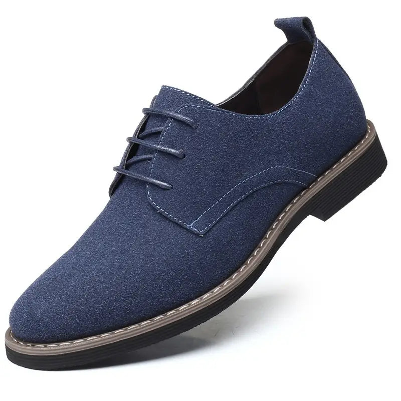 Navy blue suede lace-up men’s plus size British style casual Oxford shoe with black rubber sole and contrasting stitching.