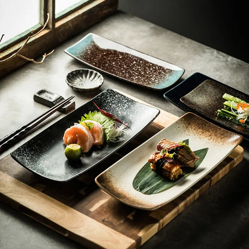 Black rectangular ceramic sushi plate with speckled texture and subtle glaze finish for Japanese ceramic sushi plates rectangular trays.