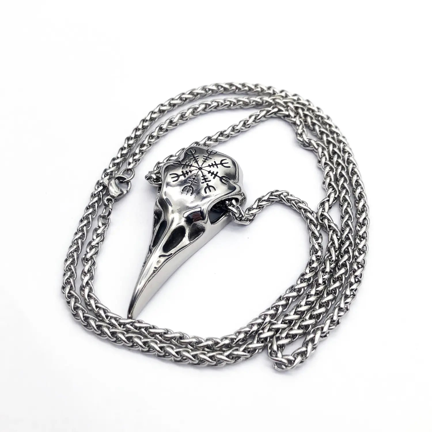 Silver vintage viking runic raven skull pendant necklace featuring a crow skull design with intricate runic engravings and a braided chain.