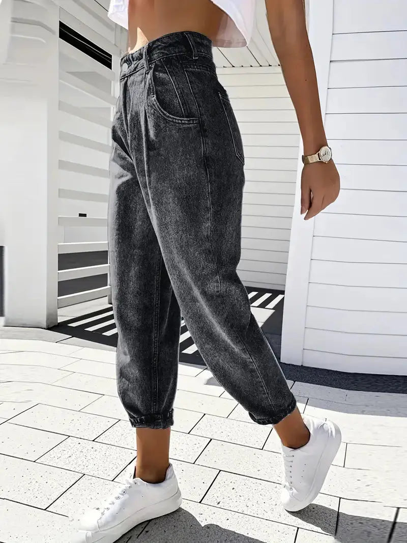 Plus size retro washed tapered denim jeans in high-waisted dark gray with a relaxed fit and cuffed hems.