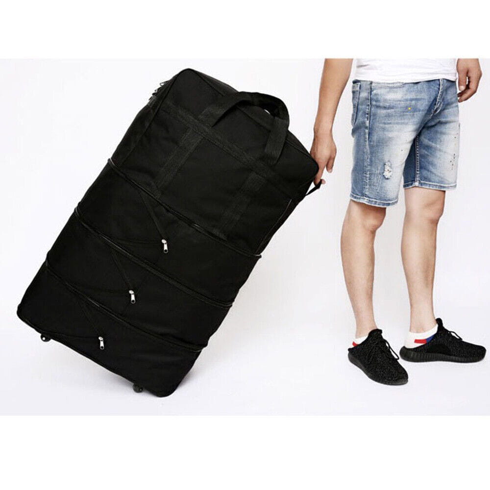 Black 42 inch expandable lightweight rolling travel suitcase with multi compartments reinforced fabric and silver zippers.