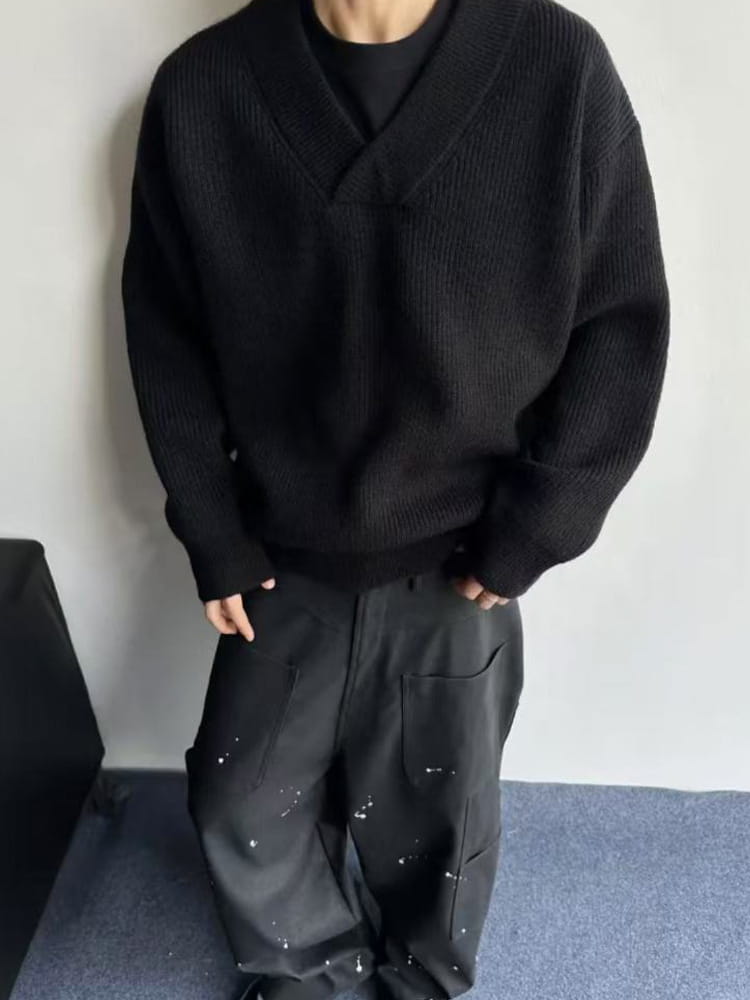 Black ribbed knit v neck sweater featuring a relaxed fit made from soft knit fabric ideal for casual wear.