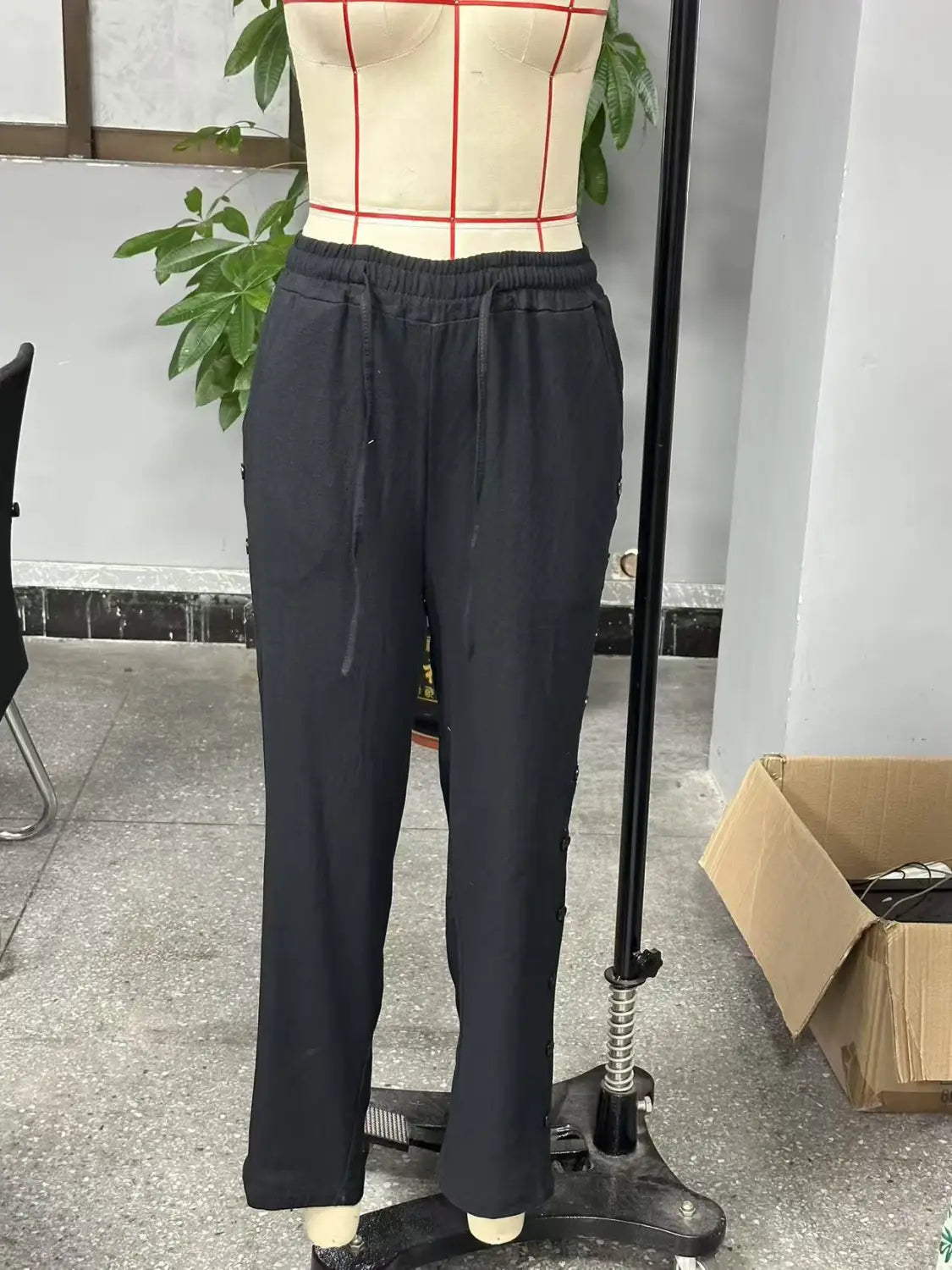 black drawstring cropped patchwork button casual pants for women with a relaxed fit and subtle side pockets