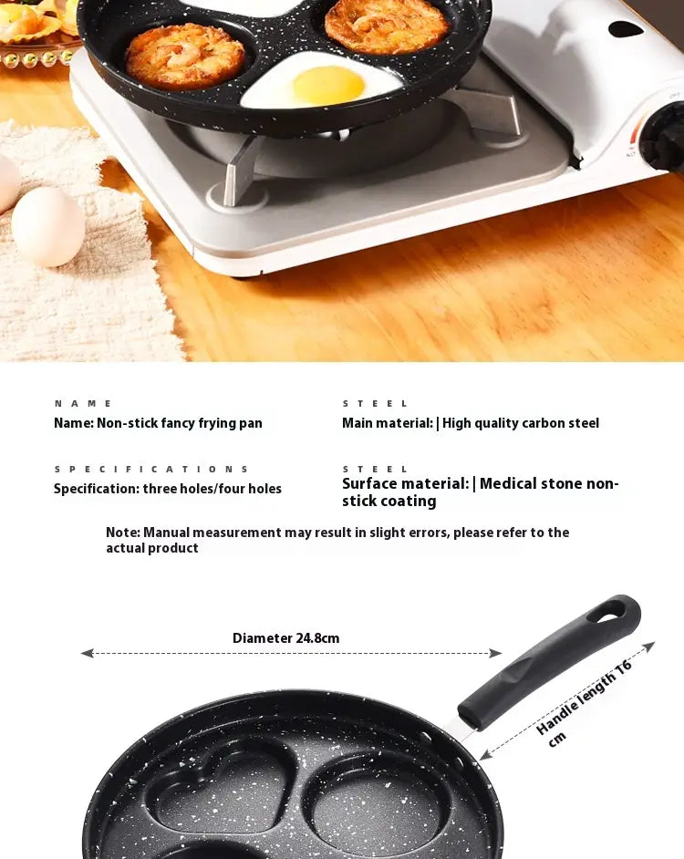 Black non-stick heart pancake pan 25cm with four cooking compartments including three heart-shaped and one round featuring a speckled medical stone coating.