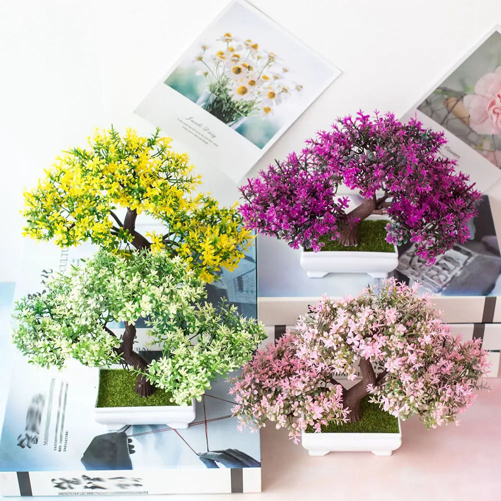 four artificial bonsai trees with yellow purple green and pink foliage in white ceramic rectangular pots with textured branches in a four pack set