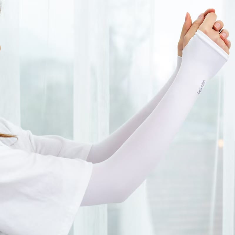 White sheer fabric uv protection cooling arm sleeve with subtle lets skin logo on the inner wristband designed for driving use