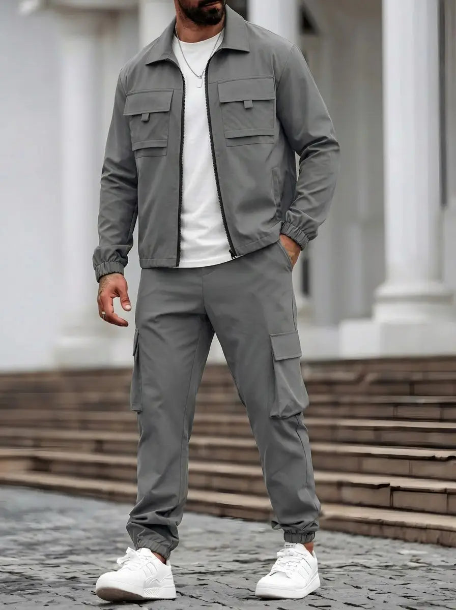 Gray mens utility zip up workwear jacket with two chest pockets and elastic cuffs designed for durability and functionality.