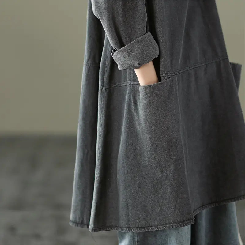 Retro artistic plus size dark gray denim tunic dress with a relaxed fit and rolled-up cuffs made of slightly faded dark gray denim.