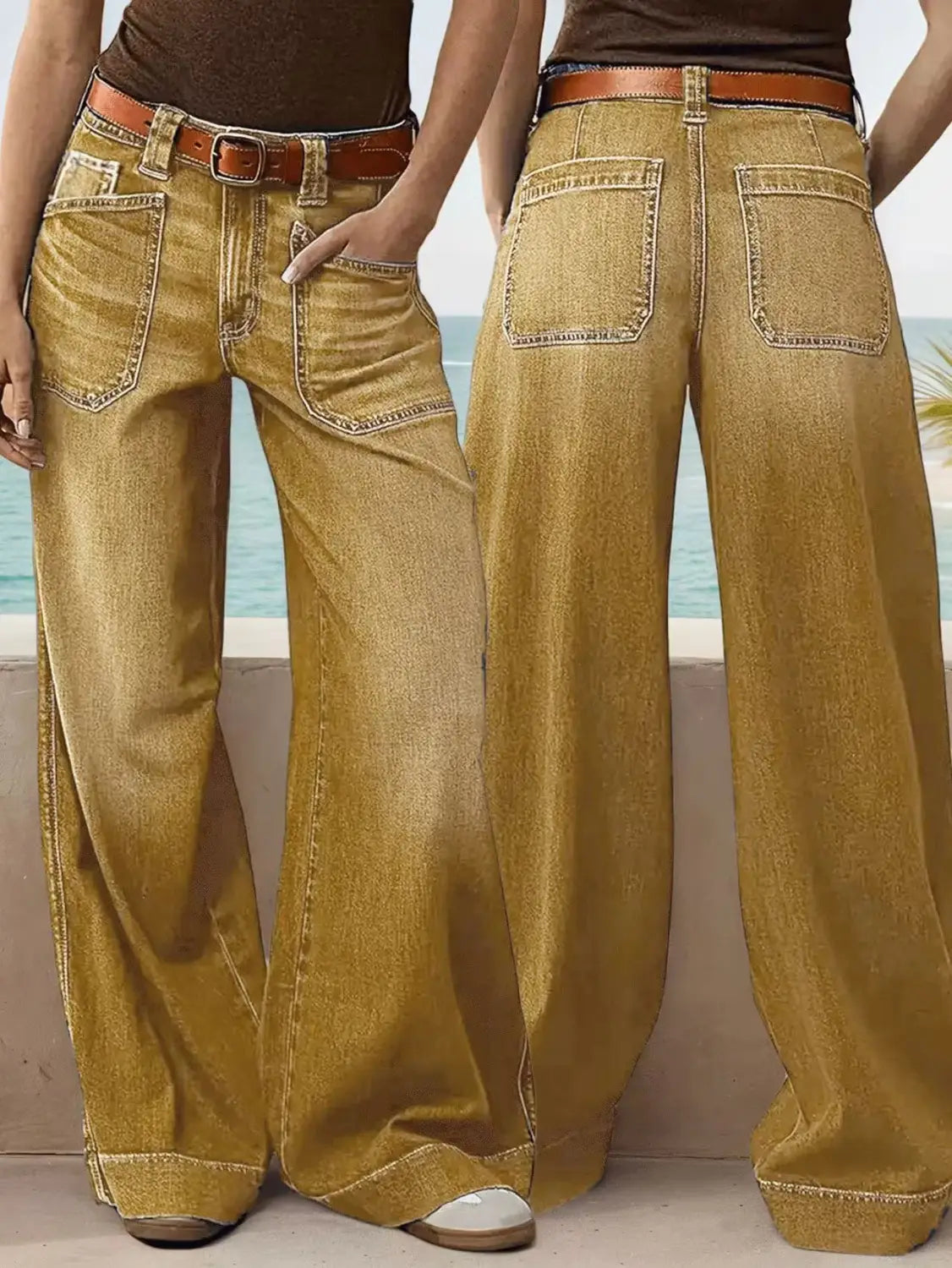 Wide leg denim pants in golden yellow denim featuring a brown leather belt and classic stitching details.