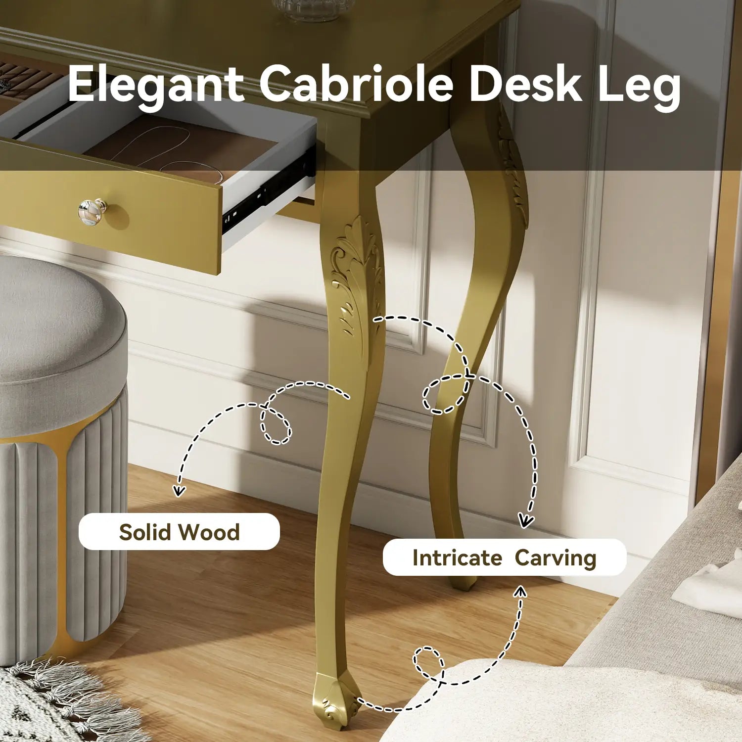 Golden solid wood cabriole desk leg with intricate floral carving on a gold makeup vanity desk with oval mirror and three drawers.