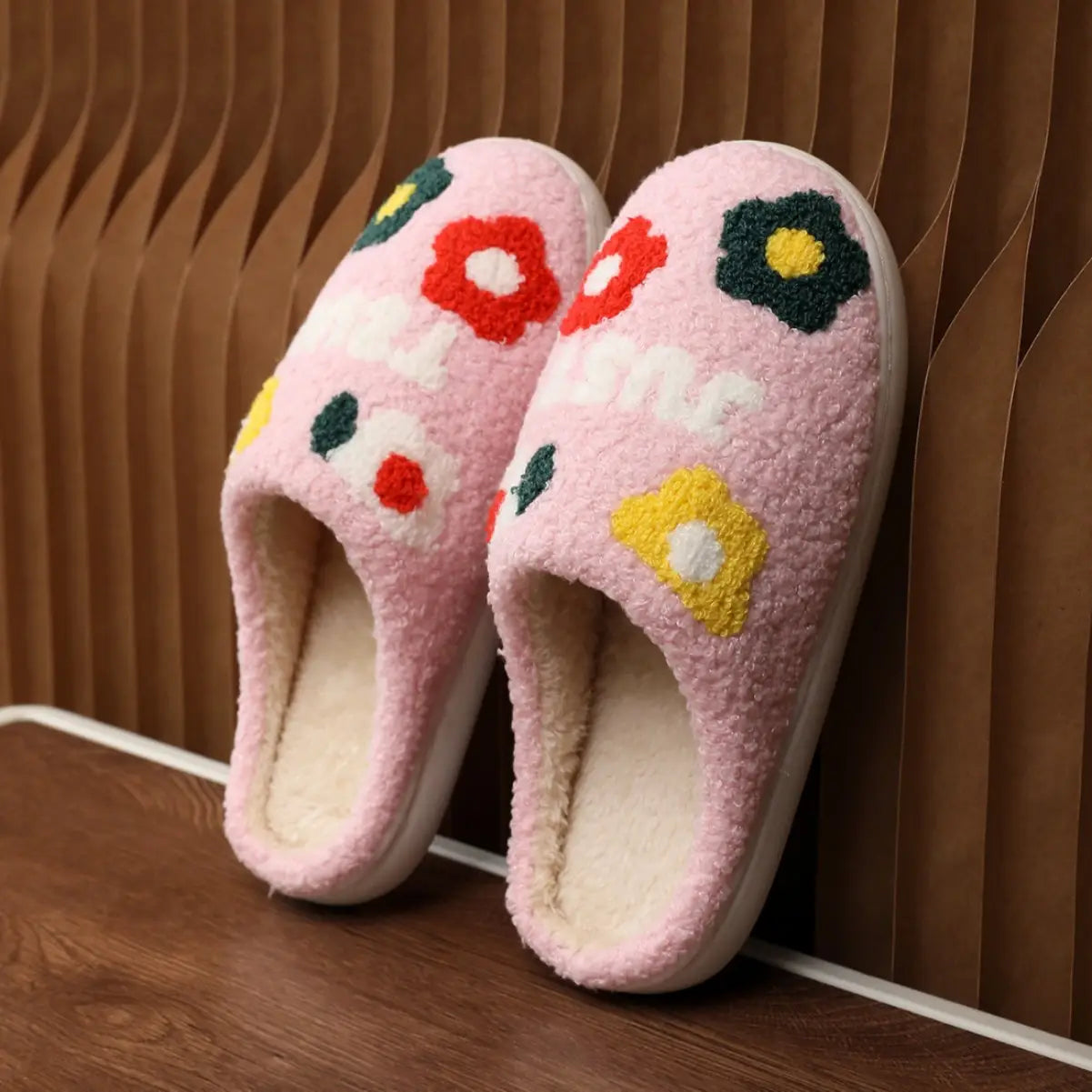 pink plush floral cotton slippers with colorful embroidered flowers white lettering and soft tpr sole
