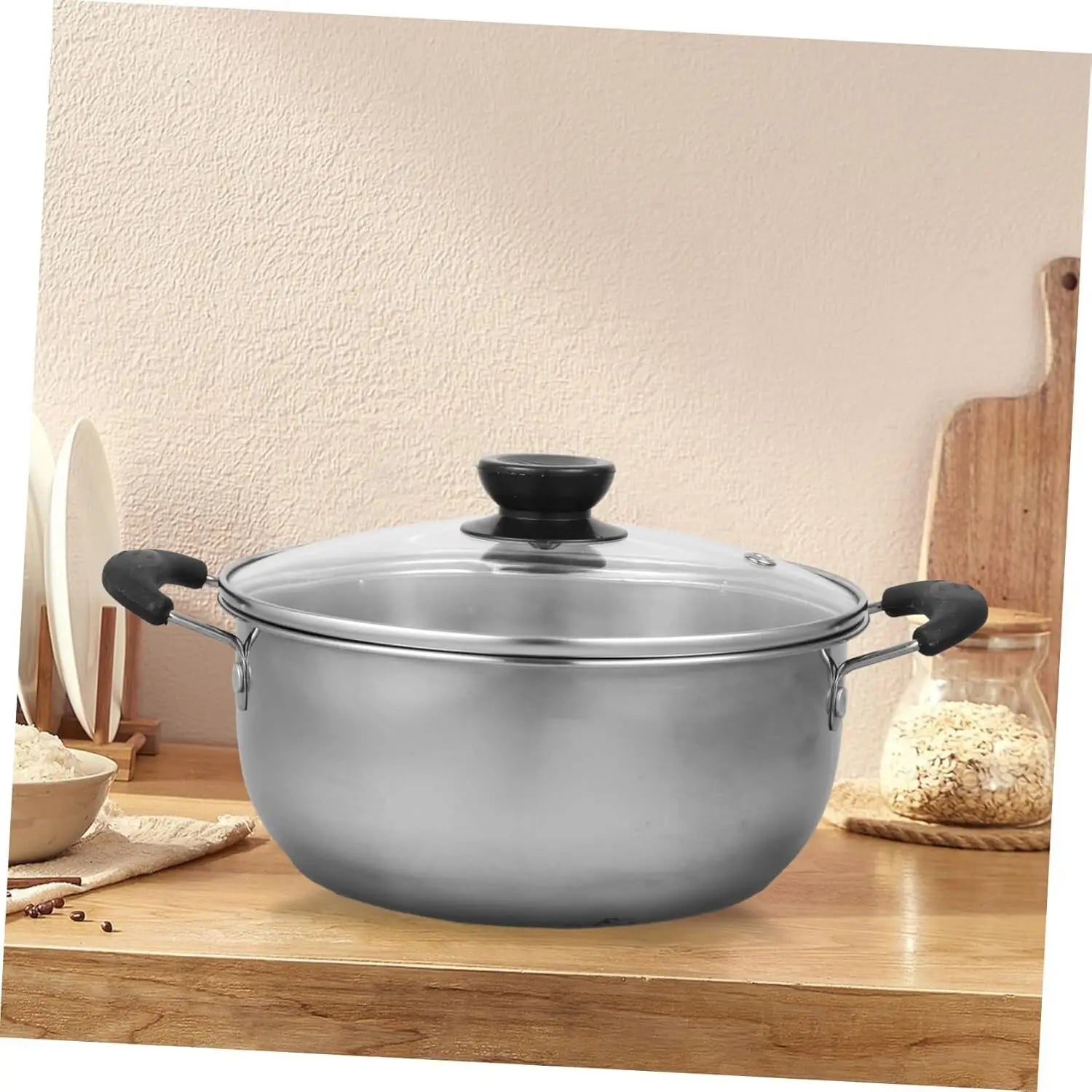 Stainless steel induction cookware set 5 pieces featuring a stainless steel pot with black handles and a clear glass lid with a black knob.