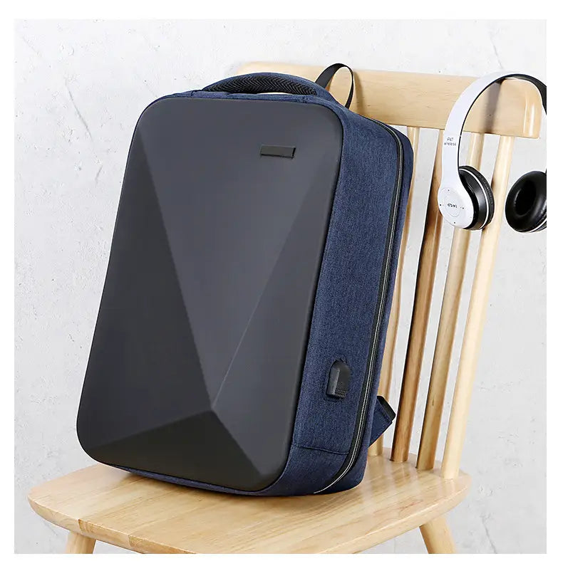 Navy blue geometric-patterned business laptop backpack made of oxford cloth with black accents and a front USB charging port.
