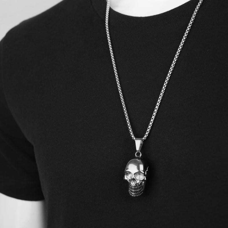 Silver skull pendant titanium steel necklace with a textured chain designed for men and women in a punk style.