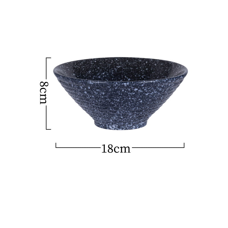 Eine dunkelblaue, gesprenkelte Keramikschale mit einer strukturierten, gerippten Außenfläche und glinner Innenfläche aus der Sets „rustikale gesprenkelte Tischgeschirre“ mit japanischen Keramikschalen.