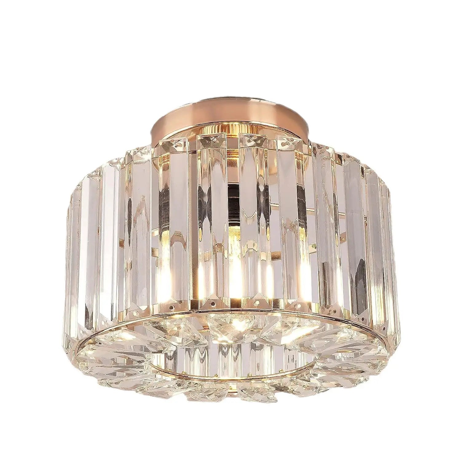 A modern crystal flush mount ceiling light with a rose gold metal base and clear faceted crystal prisms arranged in vertical columns.