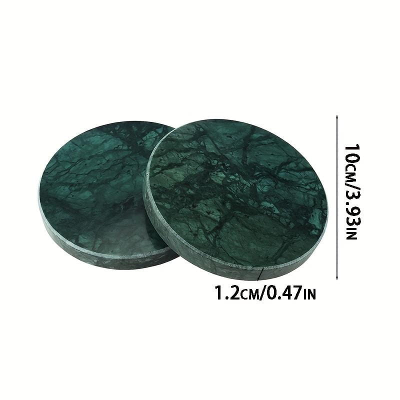 Set of four round green marble coasters featuring a polished finish and natural veining in dark green stone.
