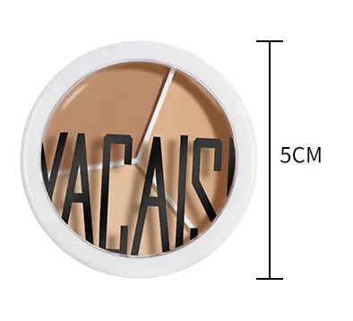 White circular compact three-color concealer palette featuring two-toned beige and light brown shades with bold black vacai lettering and a pro 270 brush for professional application.