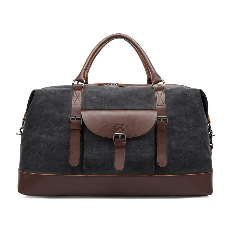 Dark gray canvas duffel bag with brown leather handles straps and trim designed as a large travel handbag.