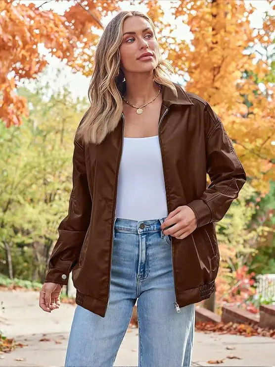 brown faux leather bomber jacket with classic collar and zipper closure in an oversized relaxed fit coat design